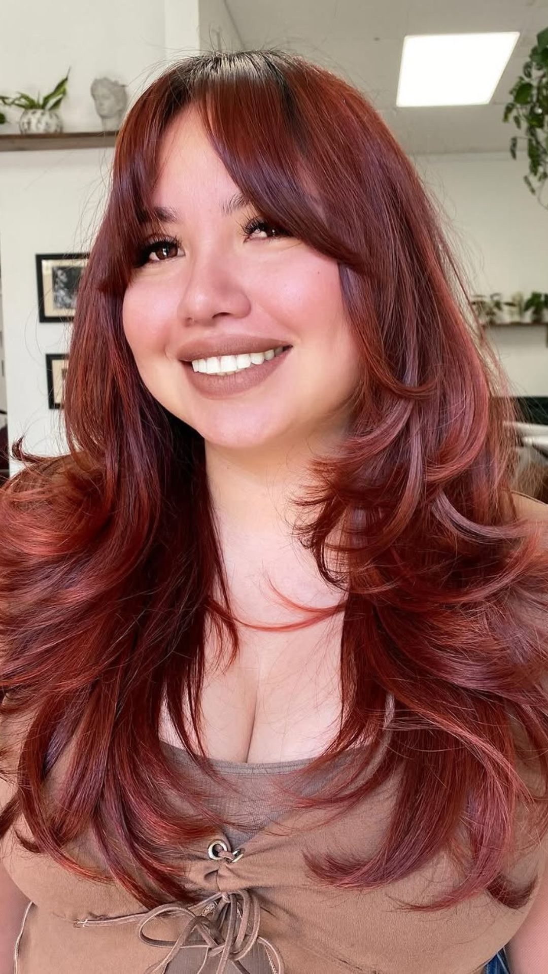 A round-faced woman with double chin modelling a Textured Layers hairstyle.