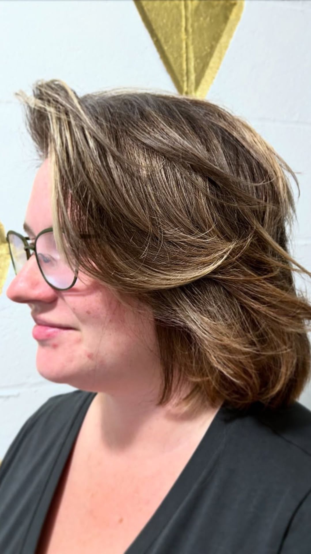 A round-faced woman with double chin modelling a Tousled Bob hairstyle.