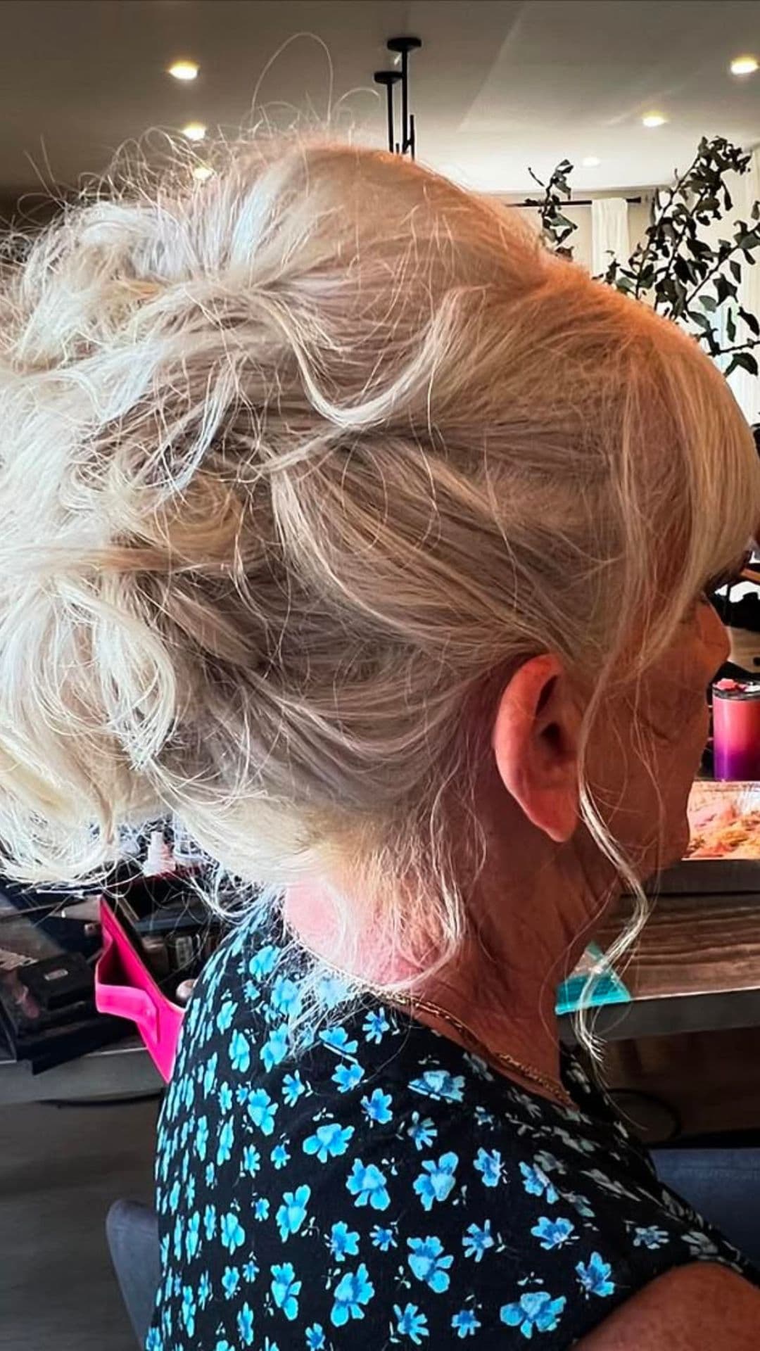 An old woman modelling a Tousled Updo with Big Bun and Wispy Face Framers hairstyle.